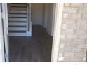 Front entry with staircase and dark gray luxury vinyl plank flooring at 559 Fundao Ln # 21, Lawrenceville, GA 30046