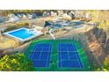 Aerial view of community pool and tennis courts at 1641 Lacebark Elm Way, Lawrenceville, GA 30045
