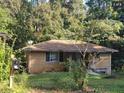 Brick ranch house with a carport and mature trees at 3345 Lake Valley Rd, Atlanta, GA 30331