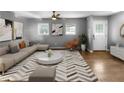 Spacious living room with hardwood floors, a neutral color palette, and ample natural light at 2653 Tilson Rd, Decatur, GA 30032