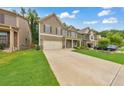 Exterior view of a two-story house with a driveway and green lawn at 437 Livingston Pt, Acworth, GA 30102