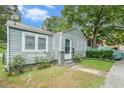 Gray house with a lattice-covered porch and small yard at , Atlanta, GA 30318