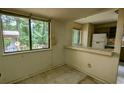 Small dining area with a breakfast bar and tile floor at 2900 Kevin Ln, Jonesboro, GA 30236