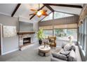 Sunroom with stone fireplace, vaulted ceiling, and comfy seating at 1715 Moores Mill Rd, Atlanta, GA 30318