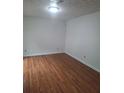 Spacious bedroom with wood flooring and neutral walls at 1847 Whitehall Forest Se Ct, Atlanta, GA 30316