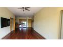 Open living room with hardwood floors, kitchen, and stainless steel appliances at 898 Oak St # 1127, Atlanta, GA 30310