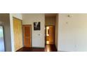 Hallway with wood floors and access to bathroom at 898 Oak St # 1127, Atlanta, GA 30310