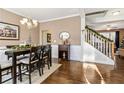 Spacious dining room with hardwood floors, chandelier, and view of staircase at 138 Stargaze Rdg, Canton, GA 30114