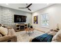 Living room with sectional sofa and geometric wall at 1587 Alder Se Ct, Atlanta, GA 30317