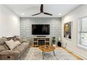 Living room with large TV and geometric wall at 1587 Alder Se Ct, Atlanta, GA 30317