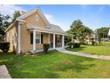 Charming house exterior with a well-maintained lawn at 6860 Main St, Lithonia, GA 30058