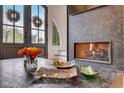 Close-up of a modern gas fireplace with decorative glass at 330 Heatherden Ave, Fayetteville, GA 30214