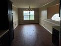 Dining room with hardwood floors and large window at 3393 Madison Farm Way, Snellville, GA 30039
