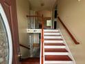 Two-story entryway with staircase and hardwood floors at 3393 Madison Farm Way, Snellville, GA 30039