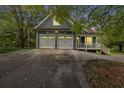 Long driveway leading to a two-car garage at 210 Pine Valley Rd, Hiram, GA 30141