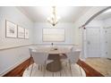 Elegant dining room with chandelier and hardwood floors at 1735 Peachtree Ne St # 321, Atlanta, GA 30309