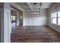 Formal dining room with hardwood floors, wainscoting, and a coffered ceiling at 1189 Red Oak Blvd, Loganville, GA 30052