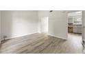 Bright living room with vinyl plank flooring and access to kitchen at 3419 River Run Trl, Decatur, GA 30034