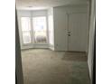 Bright living room with bay windows and carpet at 5632 Stonington Trace Pkwy, Stone Mountain, GA 30087