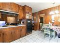 Kitchen with wood cabinets, built in oven and cooktop at 3542 Lynfield Sw Dr, Atlanta, GA 30311