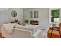 Living room with fireplace, stylish armchairs and sofa at 163 Glenrose Sw Cir, Atlanta, GA 30354