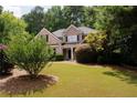 Two-story brick home with a landscaped yard at 109 Boulder View Trce # 0, Dallas, GA 30157