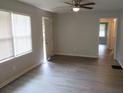 Living room with hardwood floors and neutral walls at 1650 Bridgeport Nw Dr, Atlanta, GA 30318