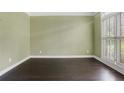 Bright home office featuring hardwood floors and plantation shutters at 5425 Edinbourgh Ct, Cumming, GA 30040