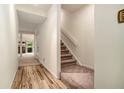 Bright entryway with wood flooring and carpeted stairs at 3630 Stonewall Se Dr, Atlanta, GA 30339