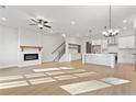 Bright living room with hardwood floors, fireplace, and kitchen view at 945 Willingham Dr # 3, Hapeville, GA 30354