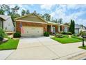 Brick ranch home with covered porch and landscaped yard at 705 Springer Mountain Dr, Canton, GA 30114