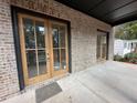 Covered back porch with double French doors at 1134 Country Ne Ln, Atlanta, GA 30324