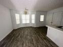 Bright dining area with chandelier and wood-look flooring at 2794 Norfair Loop, Lithonia, GA 30038