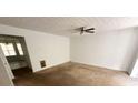 Spacious living room with ceiling fan and neutral carpeting at 2794 Norfair Loop, Lithonia, GA 30038