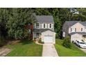 Two-story house with a brick and siding exterior, and a one car garage at 1855 Barrington Overlook, Marietta, GA 30066