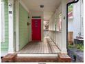 Front porch with red door and wooden flooring at 79 Hammock Pl, Atlanta, GA 30312
