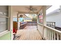 Wooden back porch with ceiling fan and view of backyard at 79 Hammock Pl, Atlanta, GA 30312