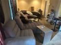 Spacious living room featuring a sectional sofa and ample natural light at 1080 Meadow Walk Ave, Lawrenceville, GA 30044