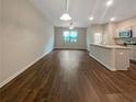 Open concept living room and kitchen with hardwood floors at 6246 Rockaway Rd, Atlanta, GA 30349