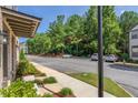 Townhomes with ample parking and tree-lined street at 3701 Allegretto Cir, Atlanta, GA 30339