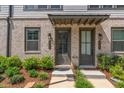 Two townhouses with gray doors and brick facade at 3701 Allegretto Cir, Atlanta, GA 30339