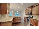 Kitchen with granite countertops and stainless steel appliances at 9378 Lantana Trl, Jonesboro, GA 30238