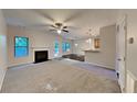 Open living room with fireplace and kitchen access at 9378 Lantana Trl, Jonesboro, GA 30238