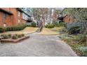 Landscaped community grounds with walkways and seating areas at 6851 Roswell Rd # B8, Sandy Springs, GA 30328