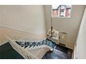 View of a winding staircase with chandelier and window at 6851 Roswell Rd # B8, Sandy Springs, GA 30328