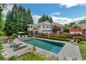 Inviting swimming pool with patio and lush landscaping at 161 Blair Valley Ne Dr, Marietta, GA 30060