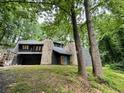 Unique stone and stucco home with wooded views at 1809 Silver Ridge Ct, Stone Mountain, GA 30087