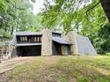 Unique stone and stucco home with wooded views at 1809 Silver Ridge Ct, Stone Mountain, GA 30087