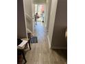 Hallway with wood-look tile flooring leading to the backyard at 1189 Ashborough Se Dr # J, Marietta, GA 30067