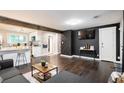 Open concept living room and kitchen with dark hardwood floors at 877 Lee Andrews, Atlanta, GA 30315